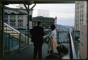 Man and woman standing on monorail platform, Seattle