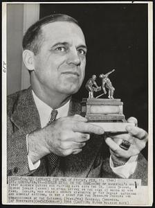 Sisler Still in the Game--One of baseball's great first basemen during his playing days with the St. Louis Browns, George Sisler (above) is still active in the game at which he won fame. Sisler, who holds a bronze statuette of Ray Schalk catching and himself batting, is now a scout for the Brooklyn Dodgers and commissioner of the National (Semi-Pro) Baseball Congress.