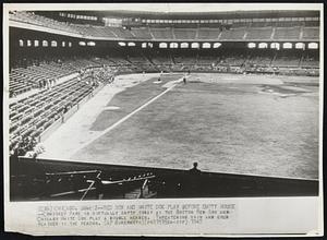 Red Sox and White Sox Play Before Empty House -- Comiskey Park is virtually empty today as the Boston Red Sox and Chicago White Sox play a double header. Threatening rain and cold weather is the reason.