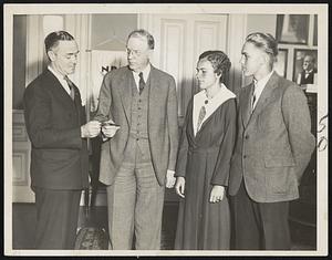 Mayor Buying Ticket For Carnival. Mayor Mansfield purchasing tickets to the outdoor wrestling carnival to be staged Wednesday night by the Crosscup-Pishon post, American Legion. Left to right, Charles J. O'Brien, vice-commander of the post, Mayor Mansfield, Helen and Billy Dettweiler, golfers here for the national open tournament.