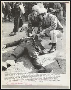 City police officer Paul Juul is ministered to by Highway Patrol officers after he was struck with a half inch castiron chair leg (on ground-R) during rioting between student dissidents & police on campus of San Francisco State College 12/3. Juul suffered a possible broken neck and his condition was described as "very serious."
