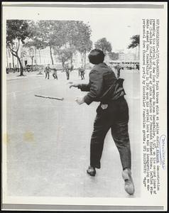 Bogota: Youth throws stick at police during student demonstration preceding the arrival of New York Governor Nelson Rockefeller, 5/27, on the second phase of his 23-nation fact-finding tour of Latin American for President Richard Nixon. Leftist student stoned Gov. Rockefeller in 1966 upon his arrival here to aid in inaugurating an experimental farm financed partly by Rockefeller Foundation grants.