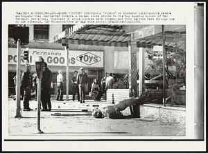 Quake 'Victim' Ignored -- A "victim" of southern California's severe earthquake lies unattended outside a broken store window in the Los Angeles suburb of San Fernando yesterday. Hundreds of store windows were broken -- and this manikin fell through one to the sidewalk.