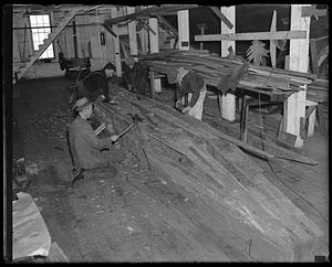 Men building something out of wood