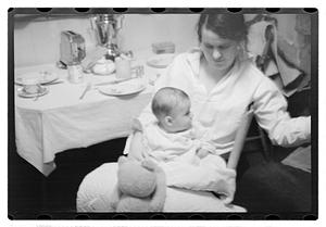 Maude Sanromá holding a baby on her lap