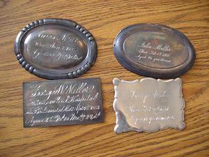 Engraved metal plates with inscriptions