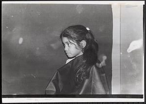 Young girl with a ponytail, seen in profile