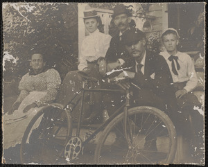 Portrait of Achsah Dimmock Scott, Elizabeth Brown Scott, Charles Dimmock Scott, and Reg Palmer Scott with bicycle
