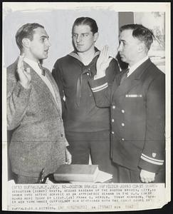 Boston Braves Infielder Joins Coast Guard- Sebastian (Sibby) Sisti, second baseman of the Boston Braves, left, is sworn into active service as an apprentice seaman in the U.S. coast guard here today by Lieut. (JG) Frank C. Herold. Tommy Henrich, former New York Yankee outfielder now stationed with the coast guard in Buffalo, is a witness.