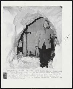 Unity, Maine. - It's Easy, Comin' Through - Declares Forrest Ames III as he pauses from tunneling his way through, rather than digging out, the drift at the door of his grandfather's potato house here. The youngster's grandfather is Morton Reynolds.