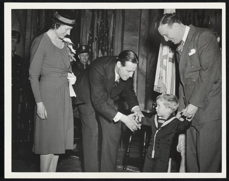 Gov + Mrs Tobin greet state Treas John J. Harley and son John Jr 3