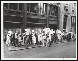 Pickets Protesting School Department's response to Kiernan Report march in front of School Committee headquarters, 15 Beacon St. The demonstrators were orderly and made no attempt to interfere with officials entering building.