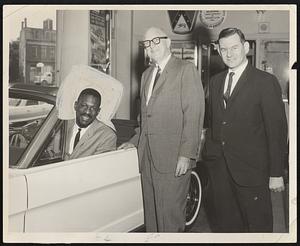 Left to right: Bill Russell, Salesman; Abe Maltz, President; and Sid Braveman, Sales Manager, of Eliot Ford, Roxbury.