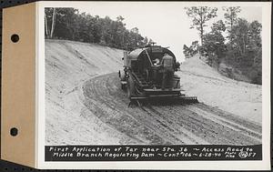 Contract No. 106, Improvement of Access Roads, Middle and East Branch Regulating Dams, and Quabbin Reservoir Area, Hardwick, Petersham, New Salem, Belchertown, first application of tar near Sta. 36, access road to Middle Branch Regulating Dam, Belchertown, Mass., Jun. 28, 1940