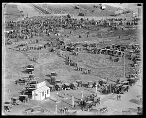 Cars and a crowd in an unidentified location