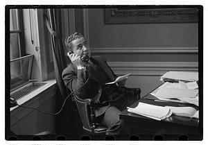 A man seated at a desk