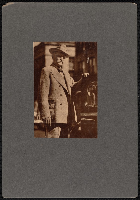 Charles S. Ashley shown by car door