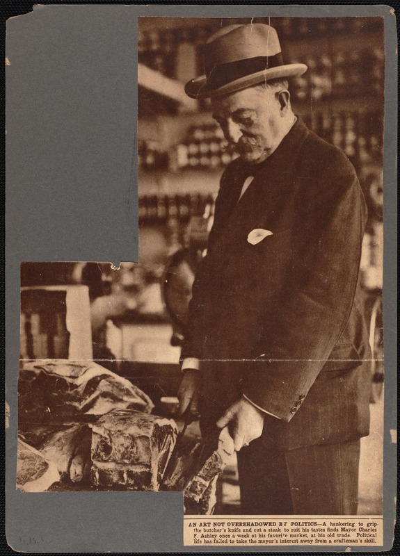 Charles S. Ashley cutting steak at butcher shop