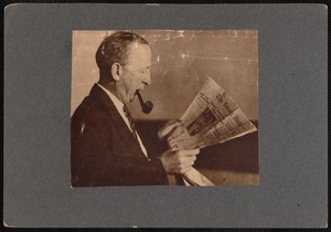Abraham Binns reading the New Bedford, MA Evening Standard.