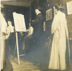Faculty with students in studio