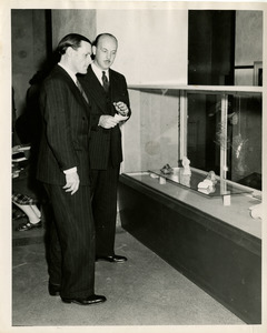 President with faculty member at exhibit
