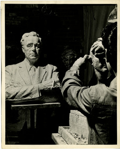 Student sculpting bust