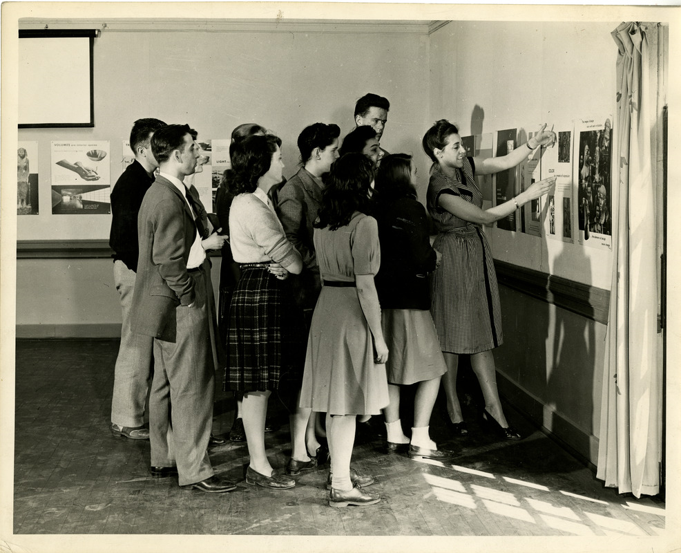 Students looking at posters