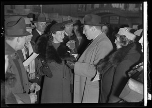 Outdoor crowd around man with WNAC microphone