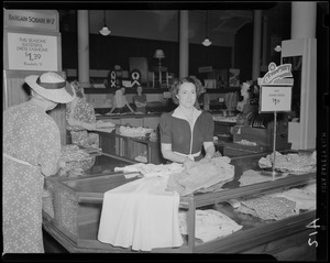 Unidentified woman behind department store counter