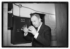 A man demonstrating how to break into a safe