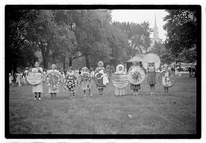 Group holding circular emblems