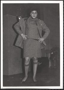 Young woman posing in a suit