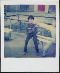Boy sitting on a bench