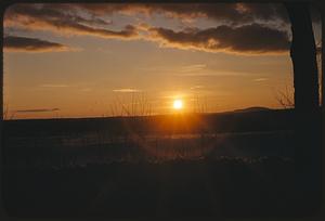 Sunrise or sunset over snowy landscape