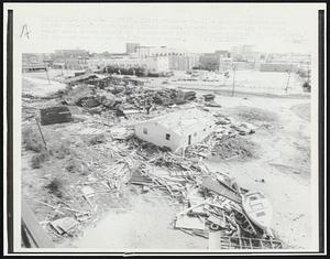 Gulfport, Miss: Hurricane Camille slammed ashore here in the pre-dawn hours with 190 mph winds. General view looking from the beach area shows debris in foreground with Gulfport skyline in background. 15 persons are known dead from the storm.