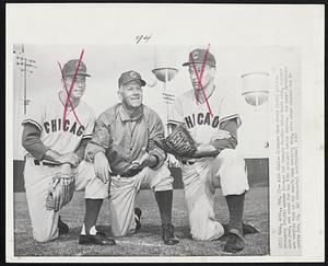 Mesa, Ariz. – Arms Okay – Pitchers Dick Drott (left) and Moe Drabowsky (right) assure Chicago Cub Manager Charlie Grimm their arms, injured last year, are sound for the 1960 National League season. The Cubs’ batterymen are keeping busy at the team’s Mesa training camp, with other players due to arrive Feb. 28.