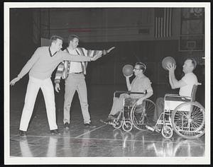 Members of N.E. Clippers Practice @ Northeastern Gym for Sunday Nite Game With Boston Collegiate Stars From N.V. & B.C. L.R. Jim Bowman - "64" Capt. of N.V. John Malvey - "63" Capt. of N.V. Charlie Kondrup - Boston Carroll Sleeper - Carlisle