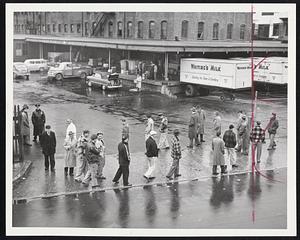 Self-Service at the Dairy Dock was a familiar sight yesterday as grocers, restaurateurs and citizens picked up milk at the Whiting Milk Company's struck Charlestown plant, above, and 11 other diaries where AFL workers are on strike. The picket lines permit entry for dock side pickups.