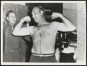 Ruffing Takes Army Physical -- Charles "Red" Ruffing, New York Yankee pitcher, is x-rayed by Pvt. Jack Levey during his physical examination for induction into the army here today. The 37-year-old ball player had been working for Vultee Aircraft Company until he was called up by his draft board.