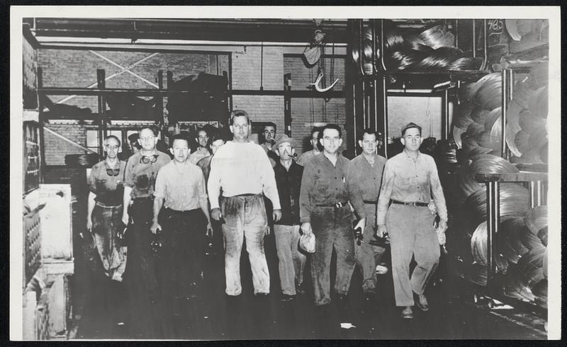 Back to Work - Workers in the Bethlehem Steel plant at Williamsport, Pa., are shown as they came down the row in the rope mill after being called back by broadcasts of radio messages.