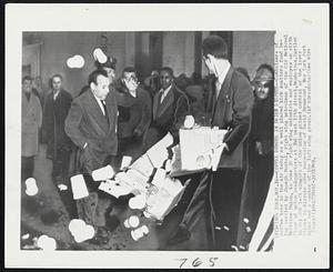 Coffee Dumped in Union Dispute--Containers of coffee take to the air today as a well placed kick scatters food being carried by Joseph Moutal, right wig patrolman of the CIO National Maritime Union, to some 30 right wing unionists and employes on sixth floor of union headquarters at 346 West 17th Street, Manhattan. Earlier in day 200 left wingers of the union gained control of the lower floors in dispute over suspension of David Drummond, New York Port Agent and a member of the left wing group.