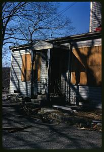 A house with boarded up windows