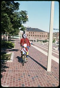 A person bicycling on Boston City Hall plaza