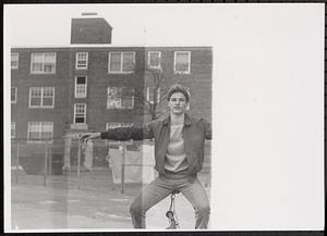 Young man balancing on a bike