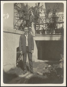 John Gardner Coolidge standing in courtyard