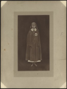 Woman in nurse uniform wearing medal of the French Society for the Aid of Wounded Military (Société Française de Secours aux Blessés Militaire or B.M.S.)