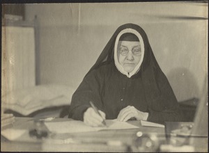 Mother Georgia Stevens writing at desk