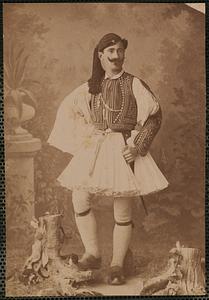 Studio portrait of man in traditional Greek dress