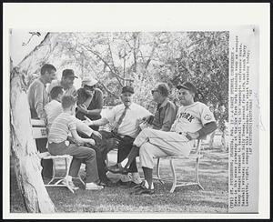 A Casey Stengel Conference - Here is the scene yesterday at the New York Mets training camp as manger Casey Stengel returned to baseball via the impromptu conference route. Baseball writers; coach Solly Hemus, second from left, and coach Harry Lavagetto, right, compose this audience. Mets start training today.