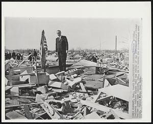Elkhart, Ind. - President Surveys Tornado Damage - President Johnson stands amid the rubble of the tornado-wrecked Midway Trailer Court near Elkhart, Ind., as he toured the storm-wrecked area today. Twenty three died here.